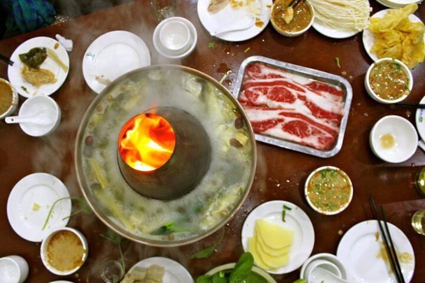 Explore the hutongs of Beijing and discover local specialties like Mongolian hotpot