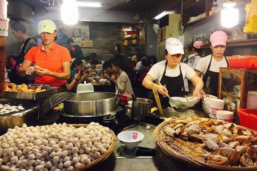 Try local street food at Jiufen old street