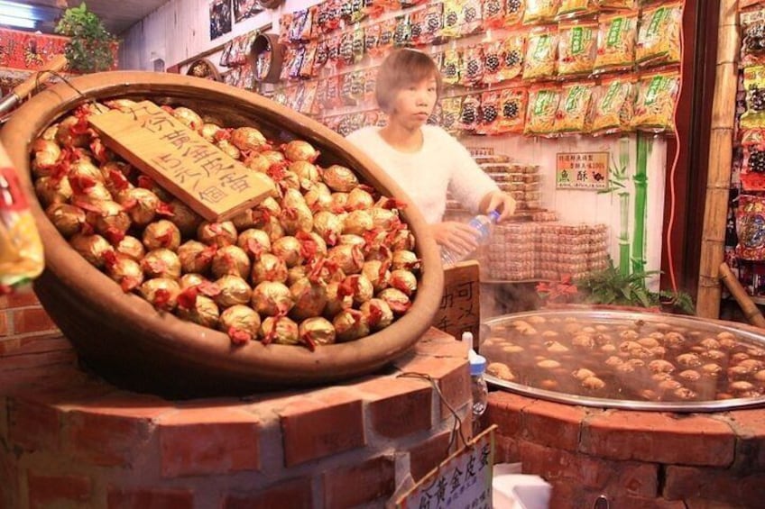 Try local street food at Jiufen old street