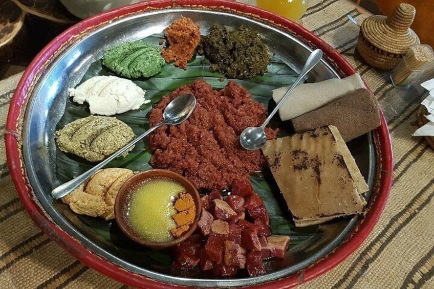 Ethiopian Food Known as Special Kitfo made of minced beef, butter, Kotcho (False Banana Tree Bread), Cheese, and spinach