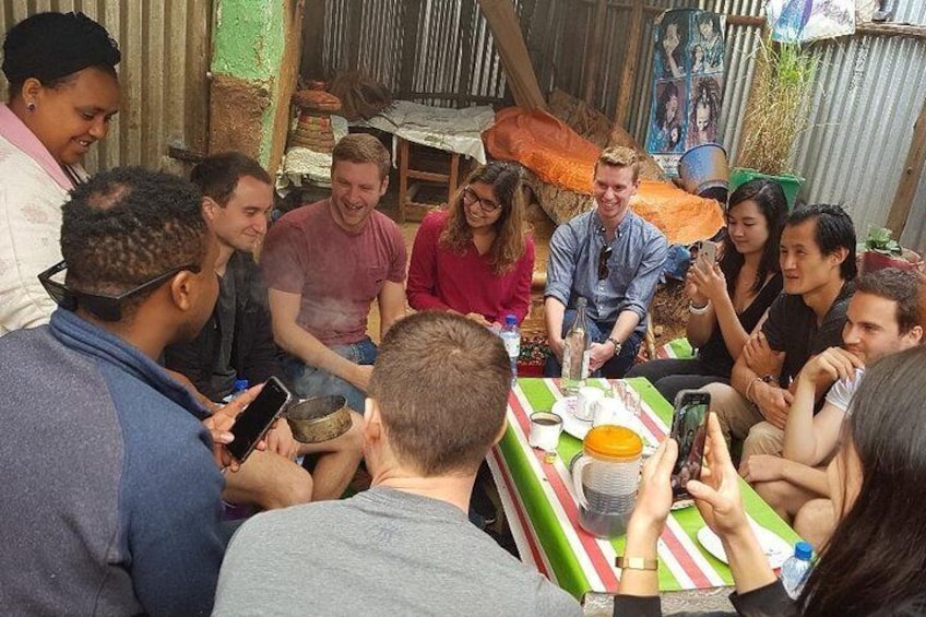 Smelling aroma of roasted coffee as part of the Ethiopian Coffee Ceremony