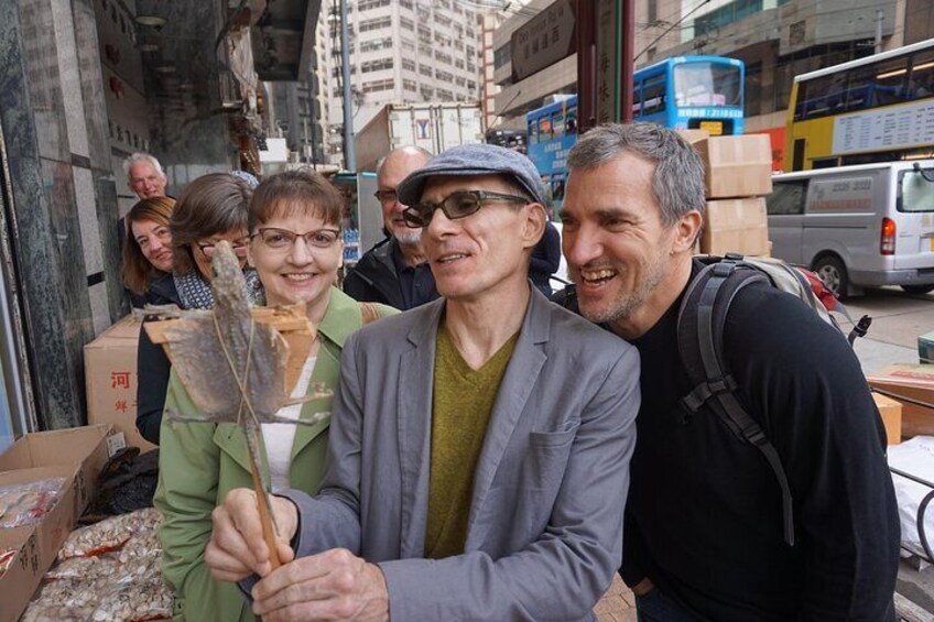 Guests fascinated by exotic food such as dried gecko