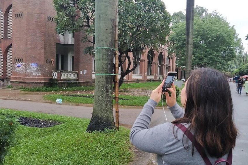 Chinese Tourist Taking Photo of Curzon Hall,University of Dhaka 