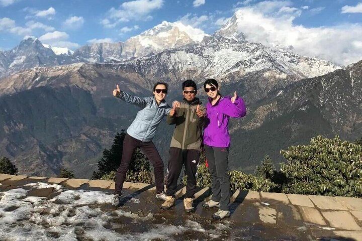 Our guide Purna in the middle with our clients.