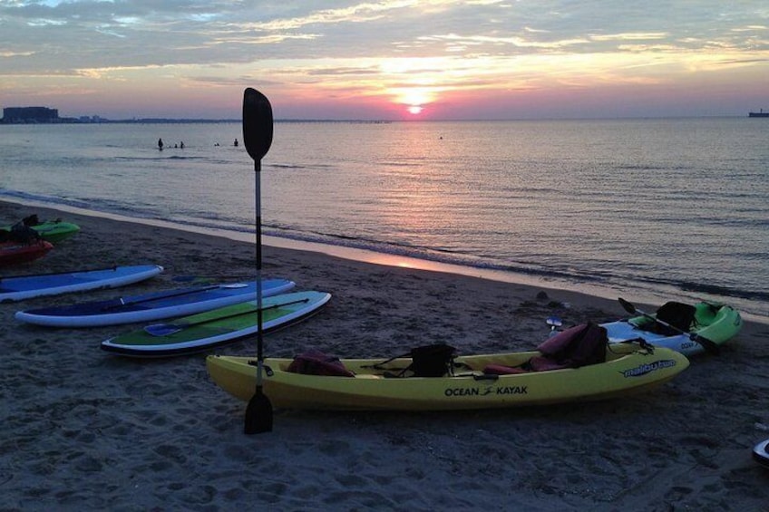 Enjoy a Sunset Dolphin Paddle along the Bay