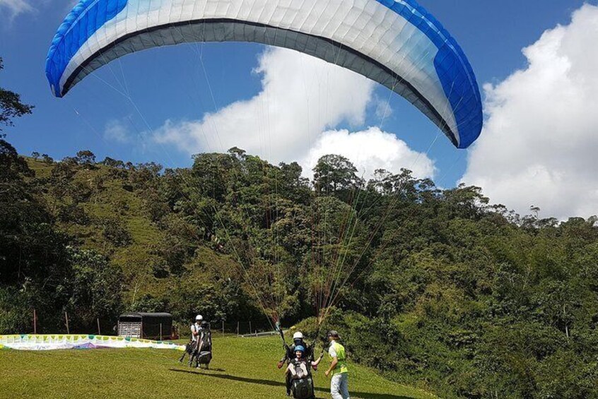 PARAGLIDING over giant waterfalls private tour plus option Guatape from Medellin