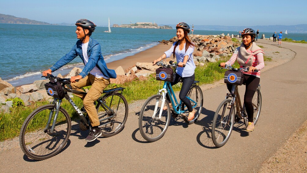 three people riding bikes in San Francisco