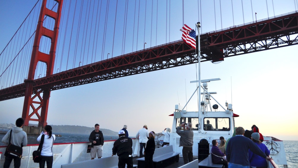 Sightseeing boat going under the Golden Gate Bridge in San Francisco