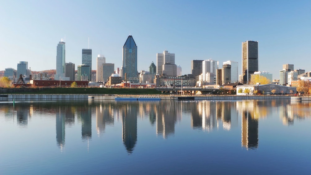 wide shot of downtown Montreal with the St. Lawrence river in the foreground