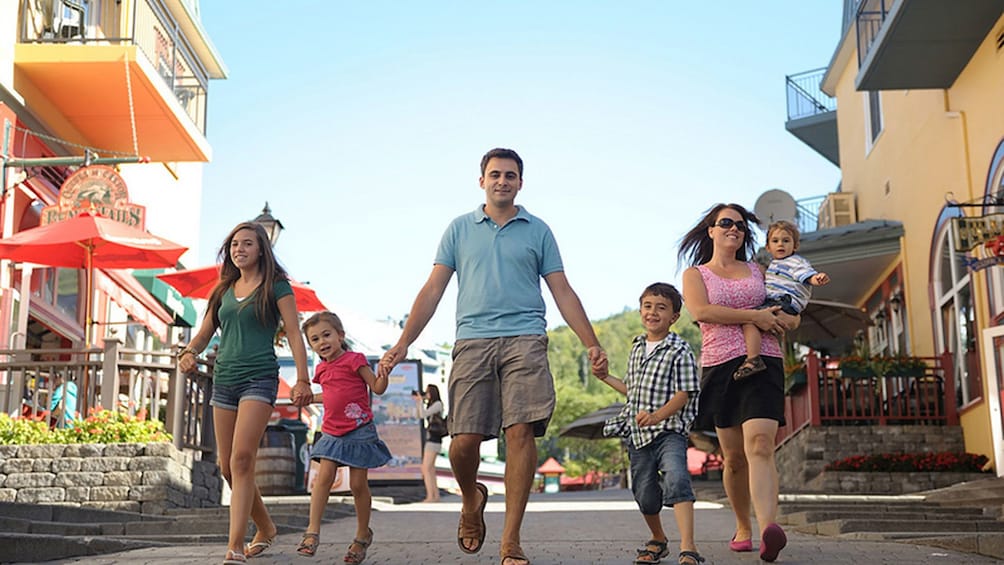 Family walking down the street in the village of Mont-Tremblant