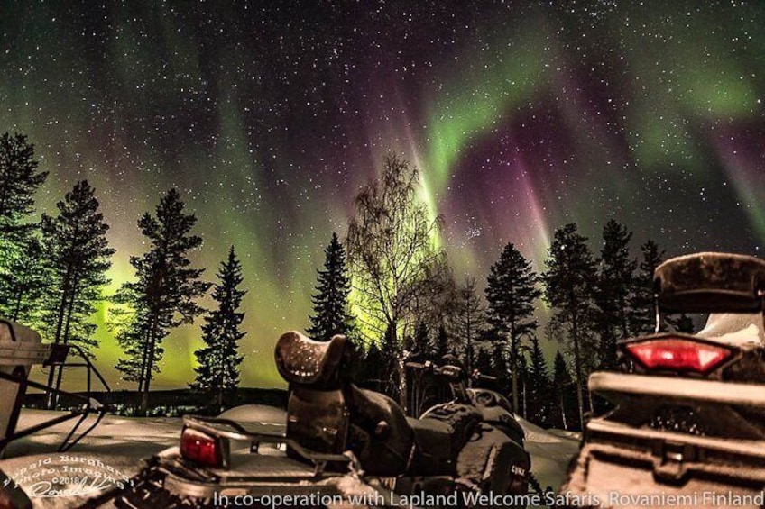 Hunting Northern Lights by Snowmobiles