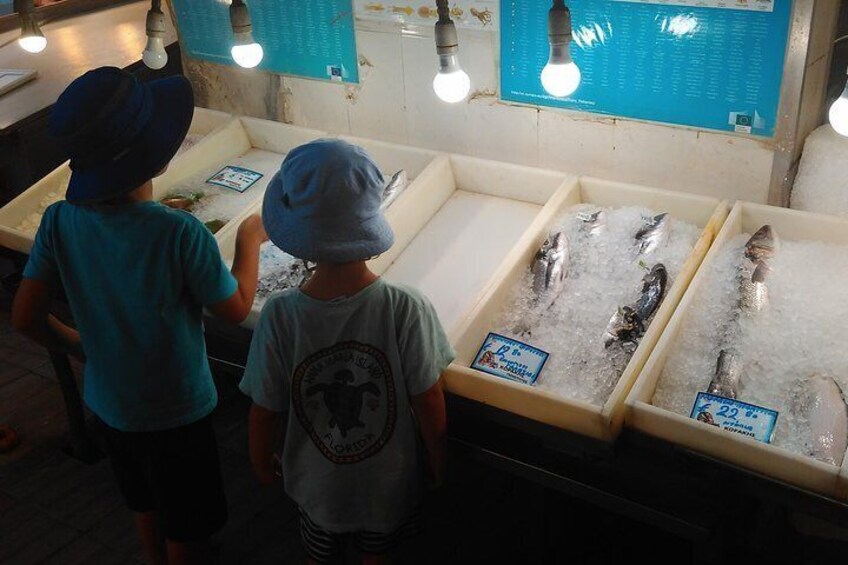 Kids exploring the fish market