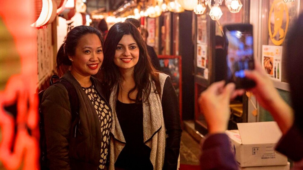 Two women take a picture in Japan