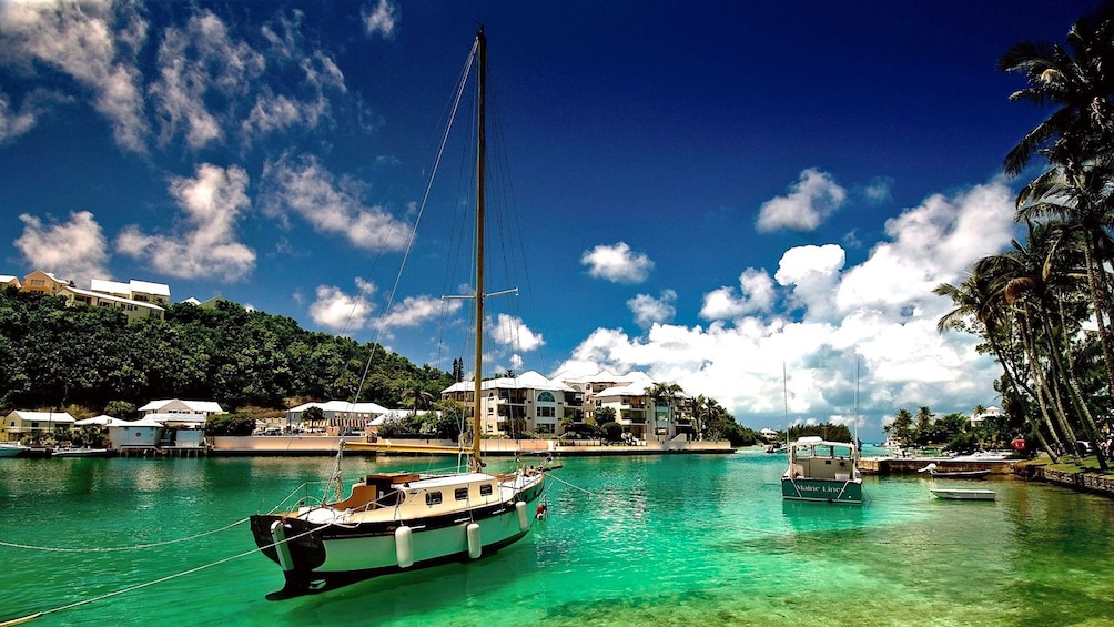 Show item 3 of 5. Boats on the beautiful blue and green waters of Bermuda's East end