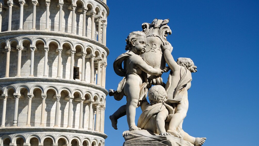 Leaning Tower and the Statue of Angels in Pisa