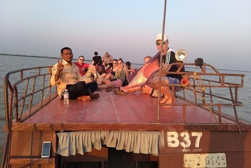 Waiting for sun set on the roof of the boat out side the village lay on the mekong river 