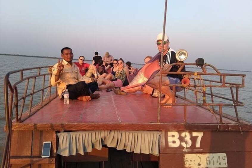 Waiting for sun set on the roof of the boat out side the village lay on the mekong river