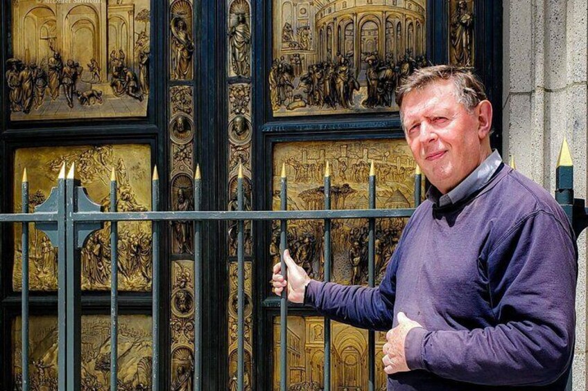 Grace Cathedral Archivist, Michael Lampen in front of the Ghiberti Doors