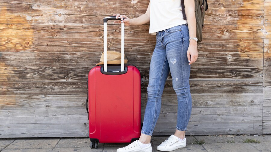 Passenger with red luggage