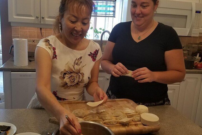 We are having fun in making dumplings together!