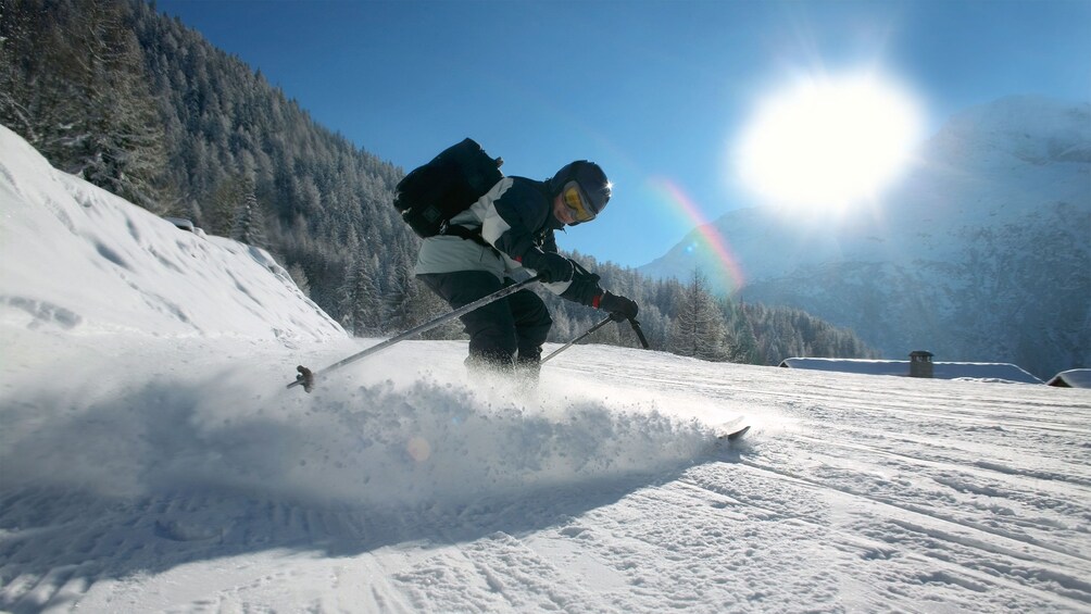 Skier enjoying a sunny day on the slopes of Banff