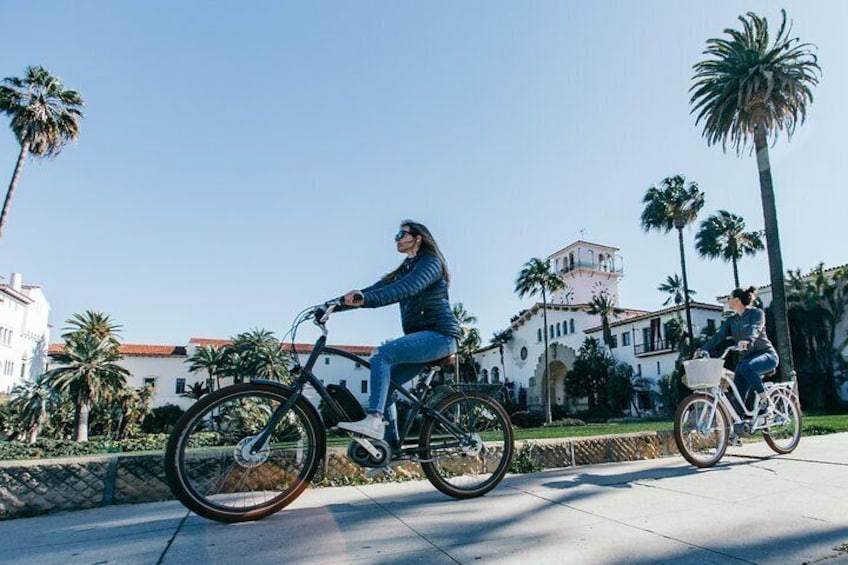 good looking ebikes, riders, and downtown architecture