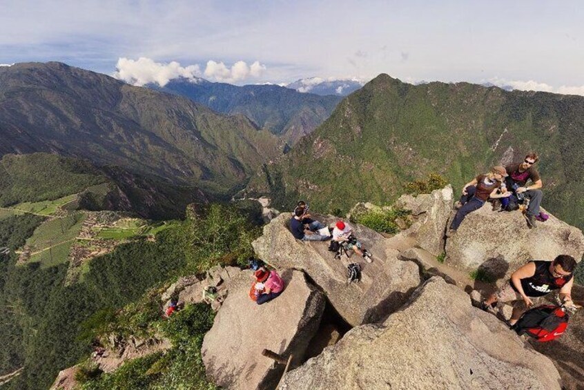 Summit of Huaynapicchu with view of Machu Picchu ruins on left side
