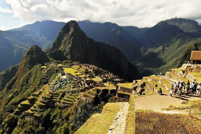 Huaynapicchu mountain is the tall mountain behind Machu Picchu ruins