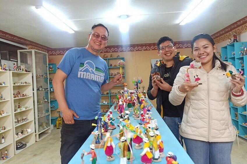 Happy tourists in the ceramic shop