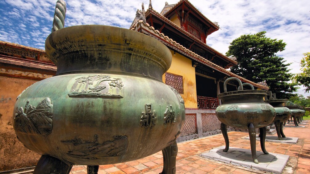 Brass pots outside a traditional building in Ho Chi Minh