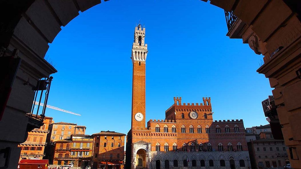 tall bell tower at the Piazza del Campo in Siena