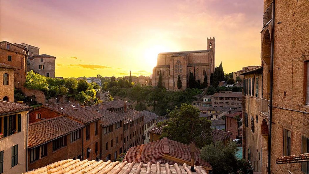 sun setting in the town of Siena