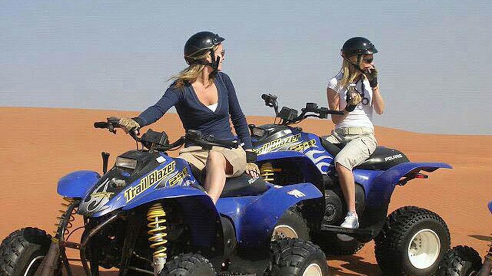 Two women on quad bikes in Dubai