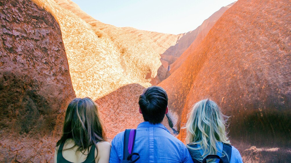 Group walking through Uluru National Park