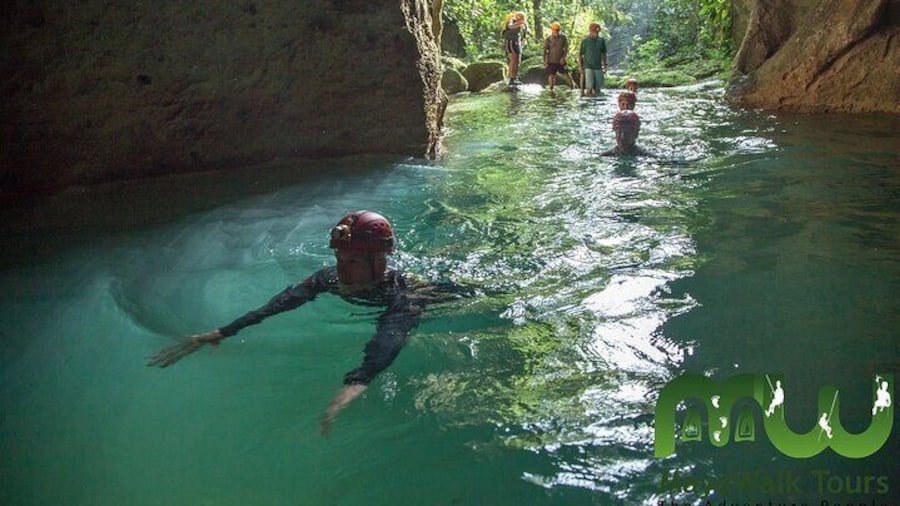Swimming into the entrance of the ATM Cave