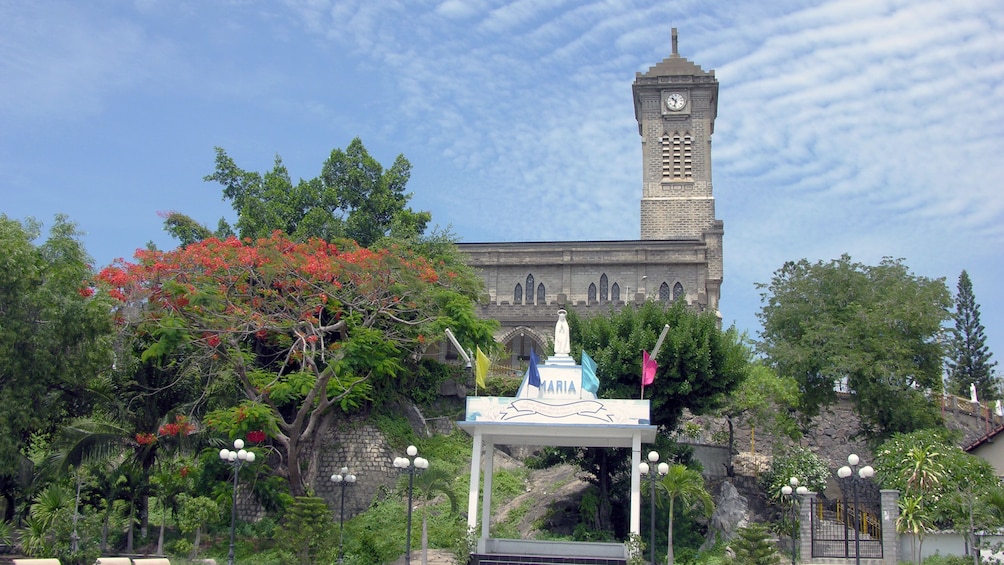Brick church clock tower in Vietnam