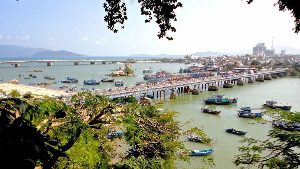 Scattered boats along a long bridge in Nha Trang