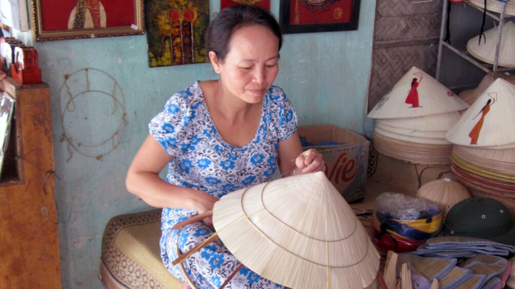 Woman making paddy hats in Nha Trang