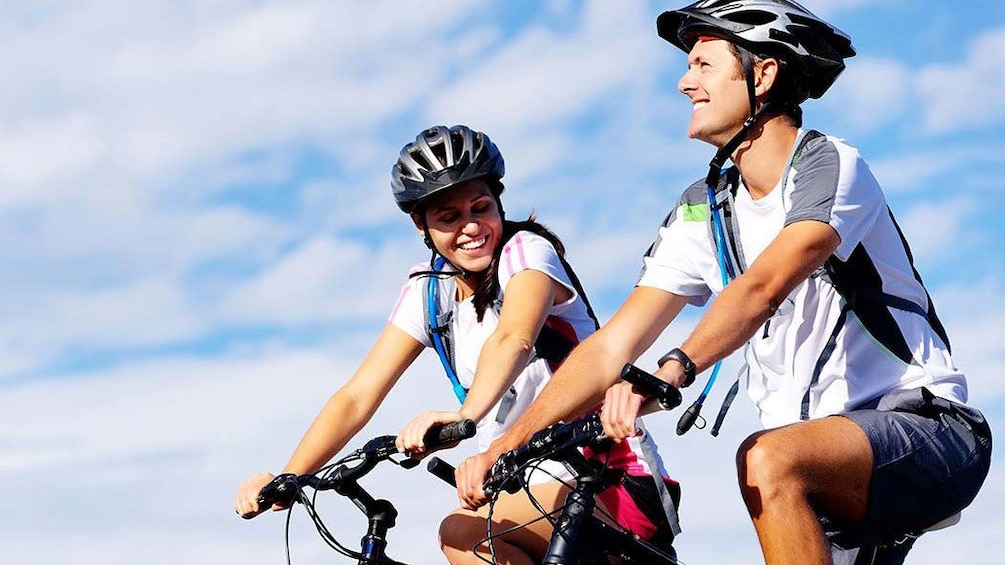 two cyclists in the sun in Italy