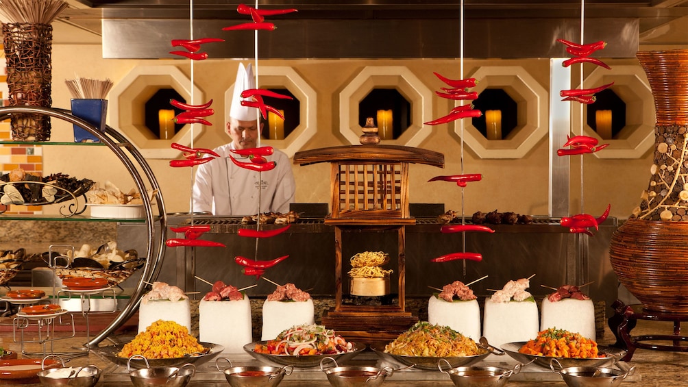 Show item 3 of 5. chef preparing food at Atlanyis buffet in Abu Dhabi