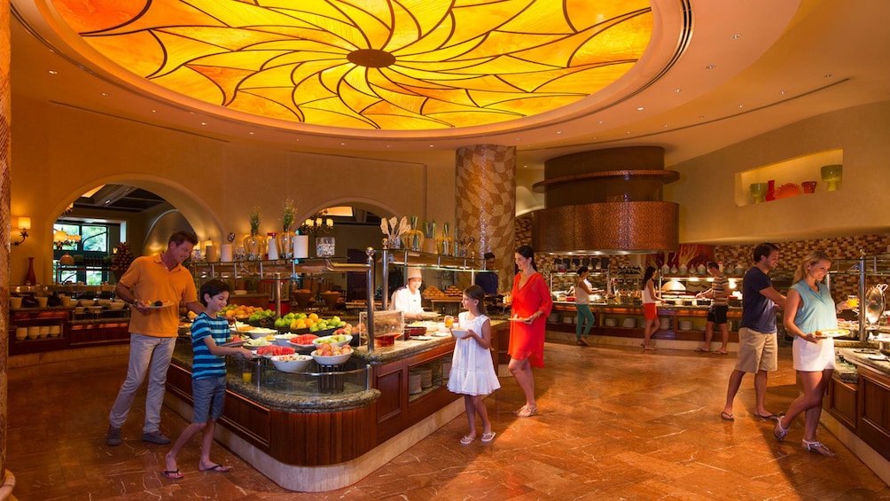 Show item 4 of 5. family going through buffet line at Atlantis in Abu Dhabi