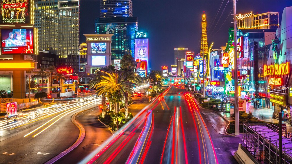Las Vegas street at night with neon lights. 