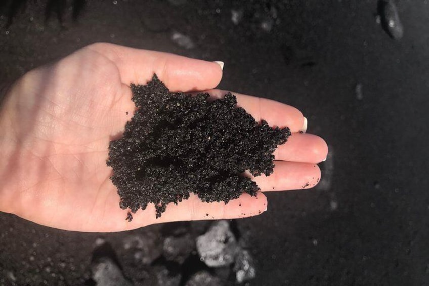 Black sand in hand