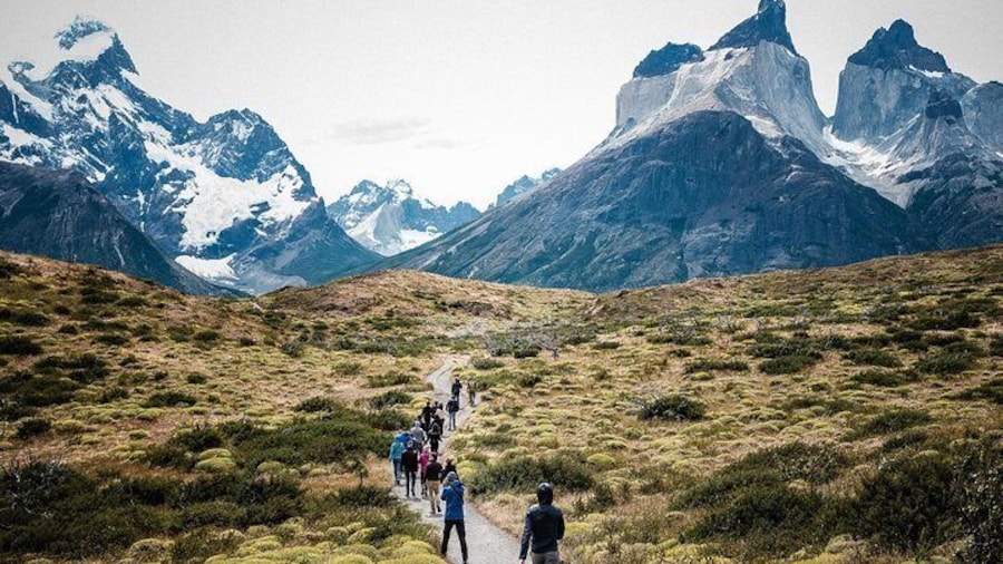 Travelers explore the exceptional beauty of Torres del Paine National Park in Chile’s Patagonia region.
