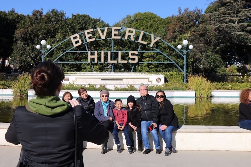 Group in front of a Beverly Hills sign in Los Angeles 
