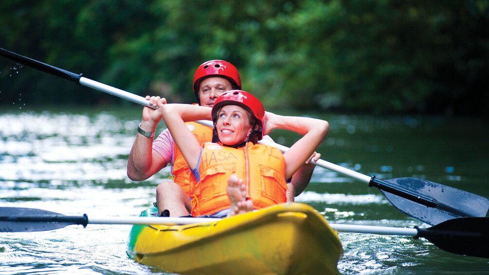 Show item 4 of 5. Couple kayaking at Ulu Temburong National Park