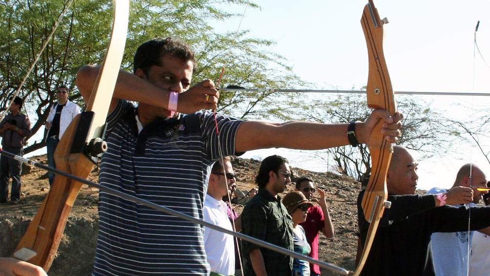 Show item 4 of 5. man at archery competition in Abu Dhabi