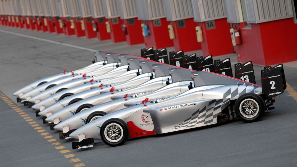 row of eight sliver racing cars in Abu Dhabi