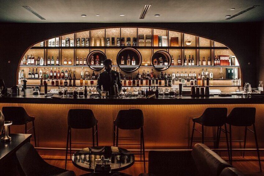 Enjoy specialty cocktails in a speakeasy bar