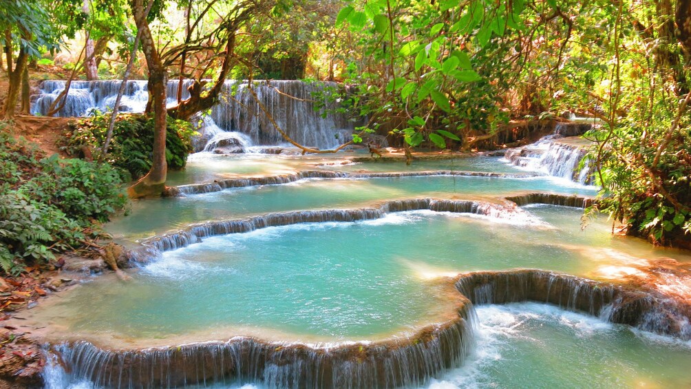 Turquoise pools at Kuang Si falls in Laos